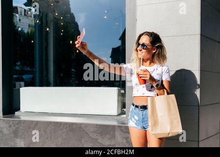 Cheerful Woman leaving restaurant Stock Photo