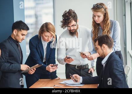 business people use gadgets at the meeting. technology, business, people, concept Stock Photo