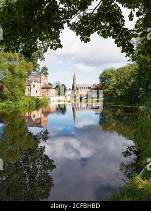 View of the river Wansbeck at Morpeth, Northumberland, UK with St Georges United Reformed Church. Stock Photo