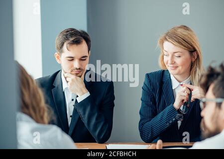 Team work process. young business managers crew working with new startup project. laptop on wood table, typing keyboard, texting message, analyse grap Stock Photo