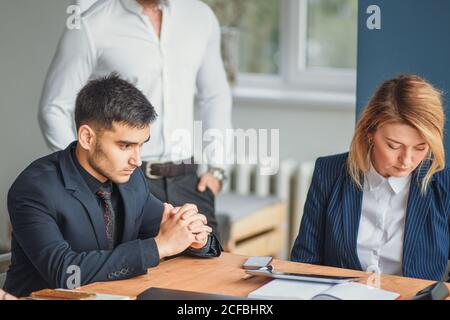 Team work process. young business managers crew working with new startup project. laptop on wood table, typing keyboard, texting message, analyse grap Stock Photo