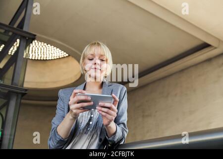 Smiling businessWoman with smartphone Stock Photo