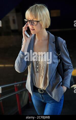 Blonde businessWoman talking on smartphone Stock Photo