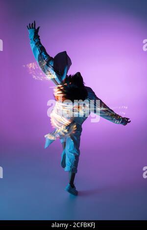 Female dancer under bright light Stock Photo