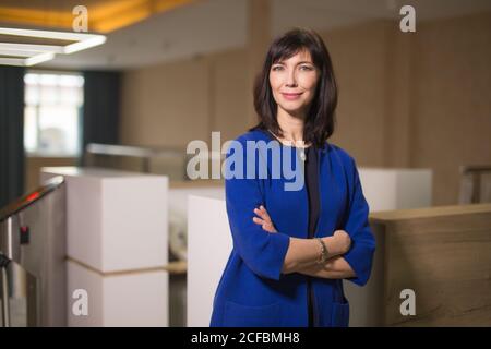 Modern smiling lawyer businesswoman stands in courthouse Stock Photo