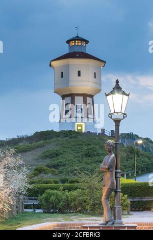 Water tower and statue Lale Andersen, Langeoog, East Frisian Islands Stock Photo