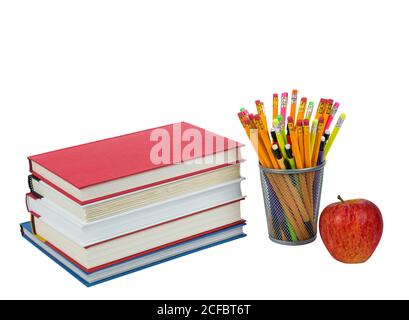 Horizontal isolated on white shot of a stack of books with colorful pencils in holder and red apple. Stock Photo