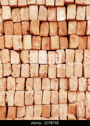 A brick is a type of block used to build walls, pavements and other elements in masonry construction Stock Photo