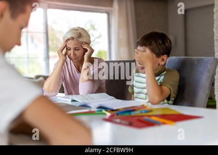 Mother and son having trouble with homework Stock Photo