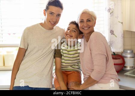 Happy mother with her two sons Stock Photo