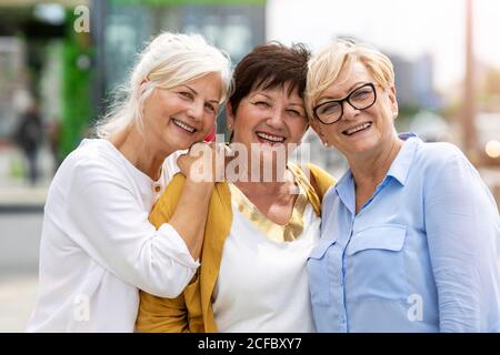 Senior female friends having good time together Stock Photo