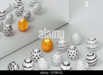 From above golden egg next to painted decorated easter eggs reflecting in a mirror on white background Stock Photo