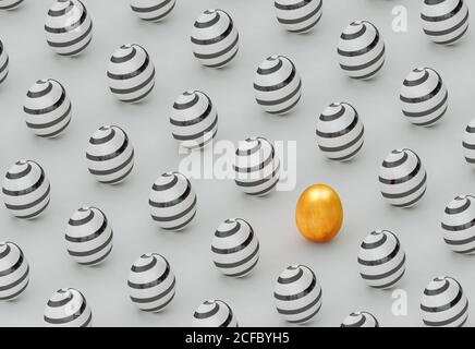 Golden egg on a background of painted eggs for Easter Stock Photo