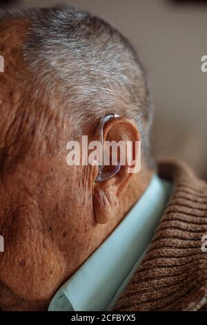 Detail of a hearing aid in an old man Stock Photo