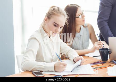 Business woman signing documents Stock Photo
