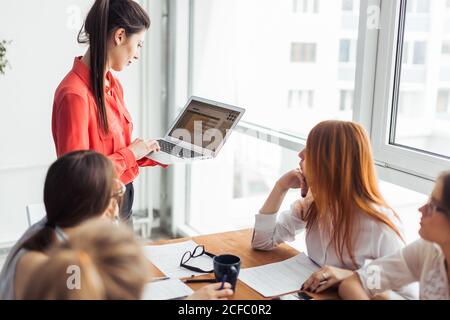 Business owner of a coffee roastery checking his laptop Stock Photo
