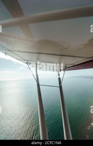 Aerial view of the sea from the inside of a small plane Stock Photo