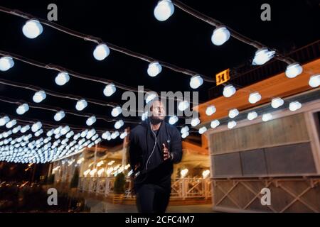 black Man running with flashes of light Stock Photo