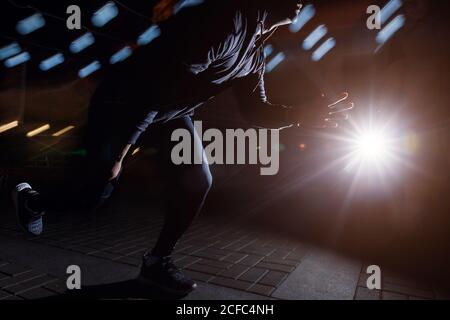 black Man running with flashes of light Stock Photo