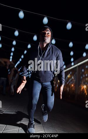 black Man running with flashes of light Stock Photo