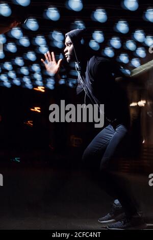 black Man running with flashes of light Stock Photo