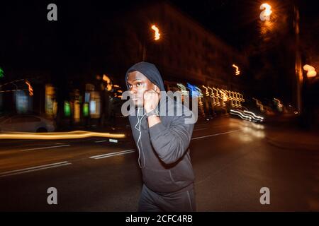 black Man running with flashes of light Stock Photo