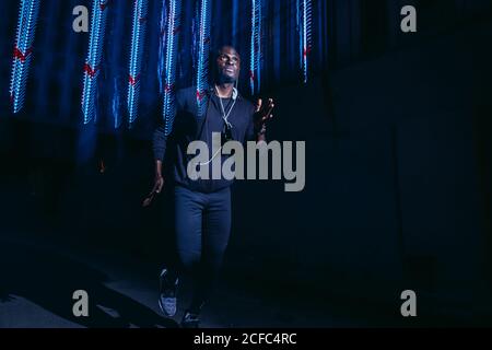 black Man running with flashes of light Stock Photo