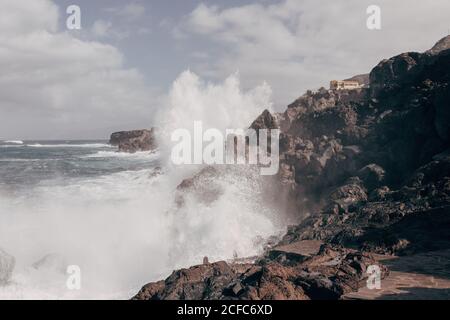 Ocean waves crashing into rocks on Tenerife Stock Photo