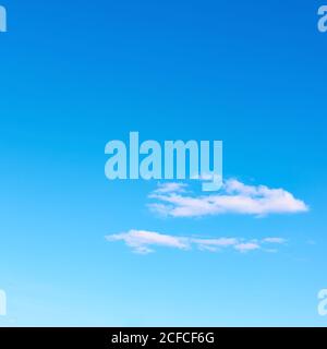 White clouds in the blue sky, may be used as background with space for your own text Stock Photo