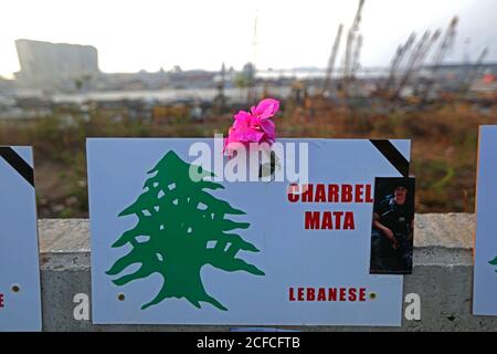 Beirut, Lebanon. 4th Sep, 2020. A placard bearing the name of a victim is hung on the roadside near Beirut port in Beirut, Lebanon, on Sept. 4, 2020. A number of Muslim and Christian clerics and a big crowd of citizens held a prayer gathering near the destroyed wheat squashes at the port of Beirut for those who died in the explosions that rocked the area on Aug. 4, al-Jadeed local TV channel reported on Friday. Credit: Bilal Jawich/Xinhua/Alamy Live News Stock Photo