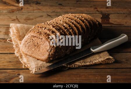 Freshly baked rye bread on napkin on table Stock Photo