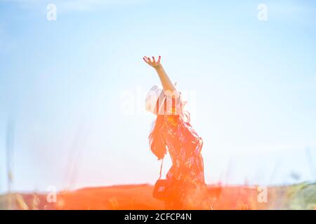Lady standing in field Stock Photo - Alamy