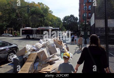 A large pile of recyclables on the sidewalk ready for collection, New York City, United States Stock Photo