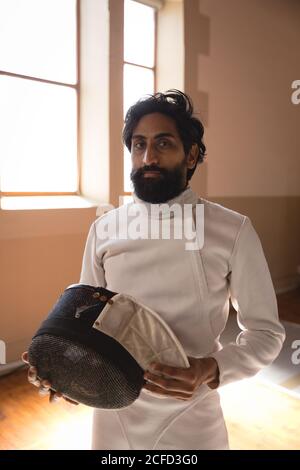 Man wearing fencing outfit Stock Photo