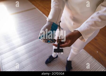 Woman wearing fencing outfit Stock Photo