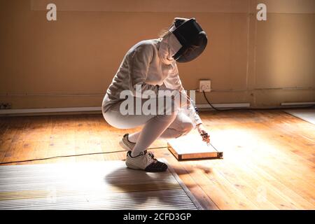 Woman wearing fencing outfit Stock Photo