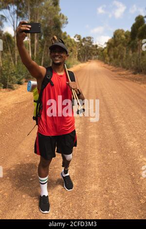 Disabled male athlete taking pictures Stock Photo