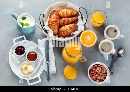 Healthy breakfast with freshly baked croissants on gray background.  Top view, flat lay Stock Photo