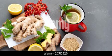 Ginger root with healthy tea with and lemon. Top view, copy space Stock Photo