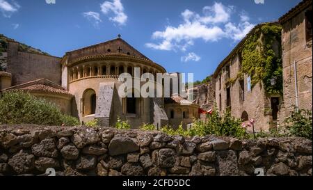 Gellone monastery in Saint Guilhem le Désert in spring. The monastery grounds were built in the 9th century and have been recognized as part of the Stock Photo