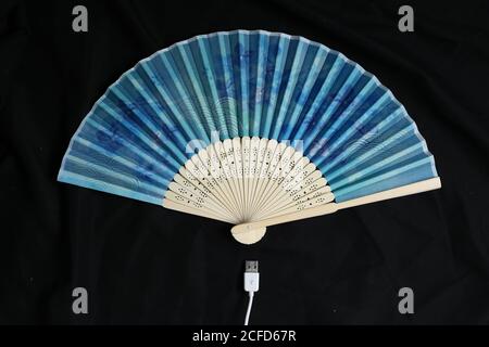 Tokyo, Japan, 09/03/2020 , portable hand fan with a electric plug. Stock Photo