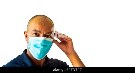 A black man is wearing a face mask over his nose and mouth. Public health concept. Stock Photo