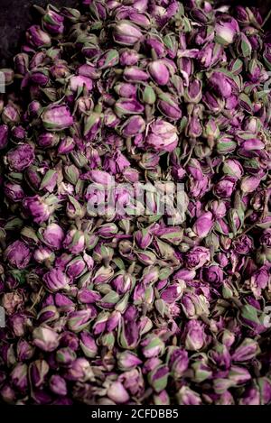From above pile of delicate dried rose buds placed on stall on market in Marrakesh, Morocco Stock Photo