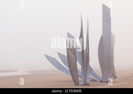 Vierville sur Mer war memorial on Omaha Beach on a foggy day in late December. Stock Photo