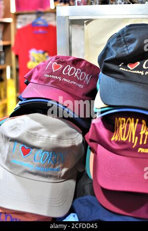 A stack of caps that are on display in a countryside gift shop in Coron, Palawan Stock Photo