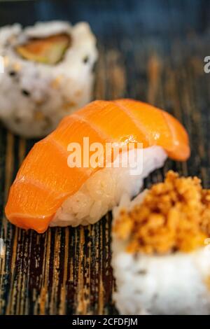 a close up image of a selection of different sushi styles on a plate portrait Stock Photo