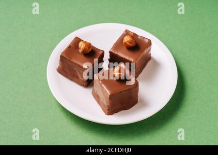 Chocolate dessert with hazelnuts on plate Stock Photo