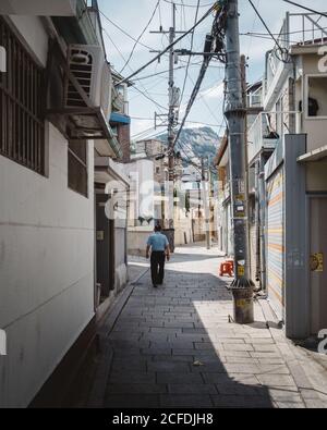 Seoul, South Korea - An old man walking through the alley in Seochon, the village located west of the Gyeongbokgung Palace. Stock Photo