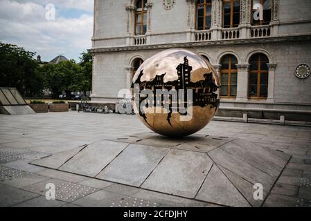 Sculpture 'Sphere Within Sphere' by Arnoldo Pomodoro on the grounds of Trinity College, Dublin, Ireland Stock Photo