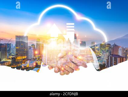 success businessman shakehand with partner business teamwork with big cloud data storage transfer online database concept of smart cyber connection te Stock Photo